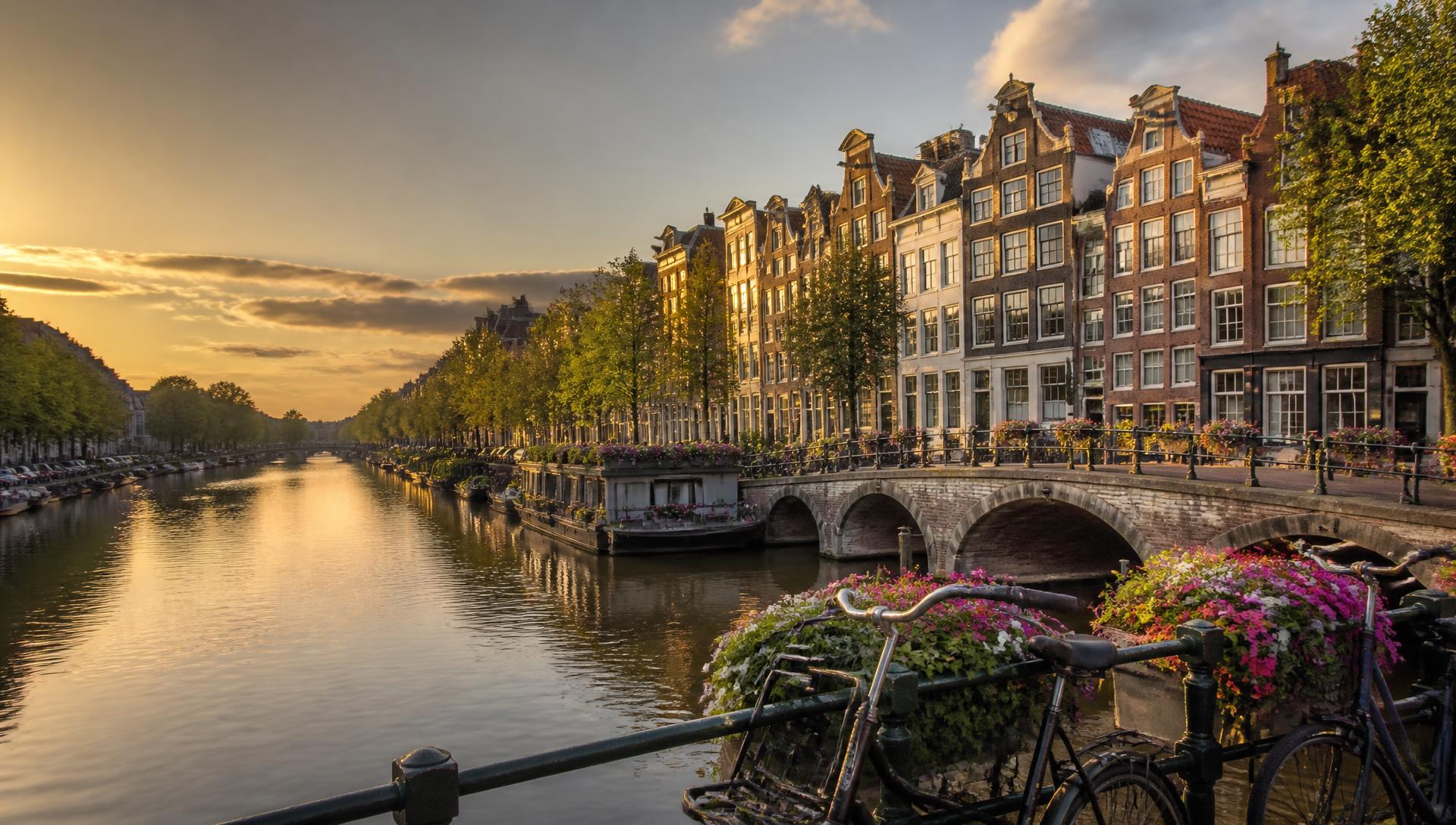 Amsterdam canal houses glowing in the evening sun